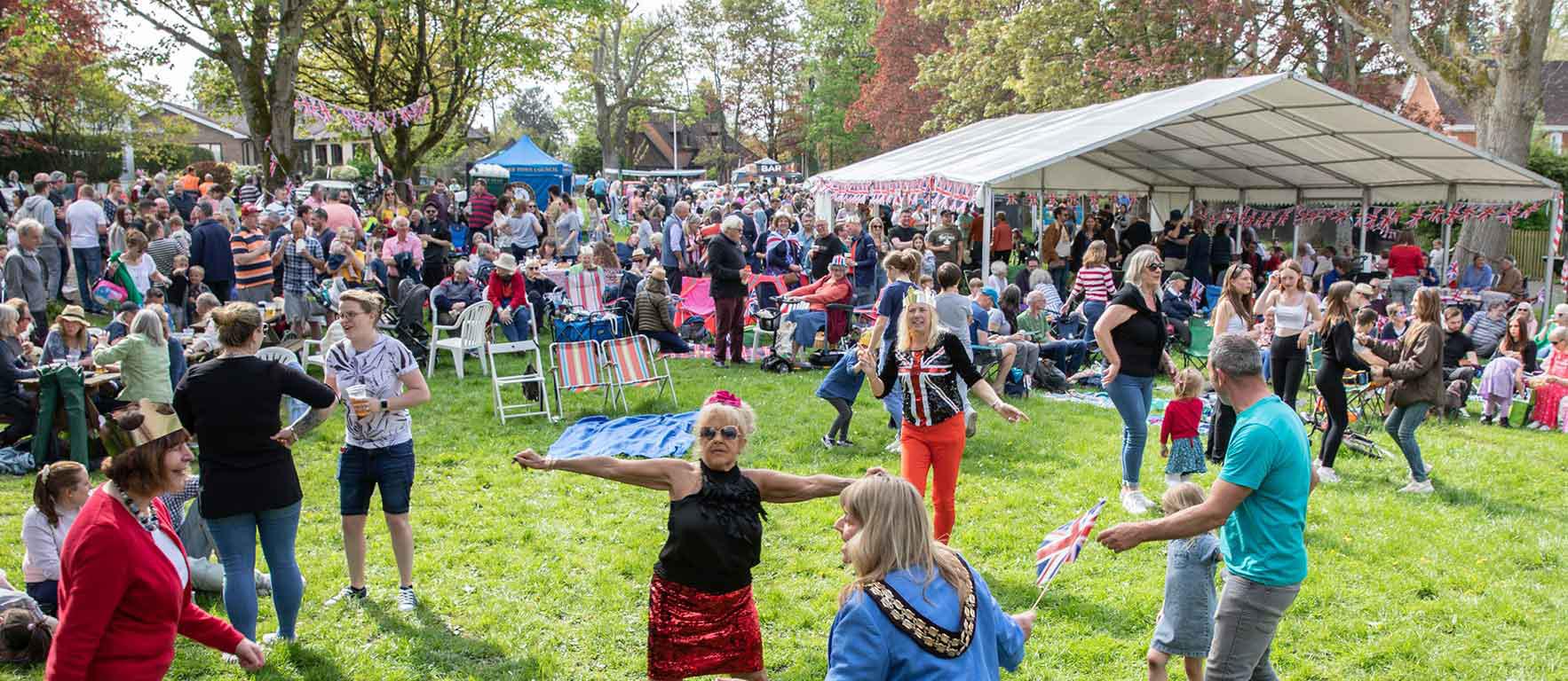 People dancing and celebration at the Coronation Celebration